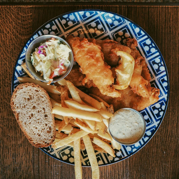 Centraal's blue and white geometric plate with a Classic Fish Fry and all the fixings
